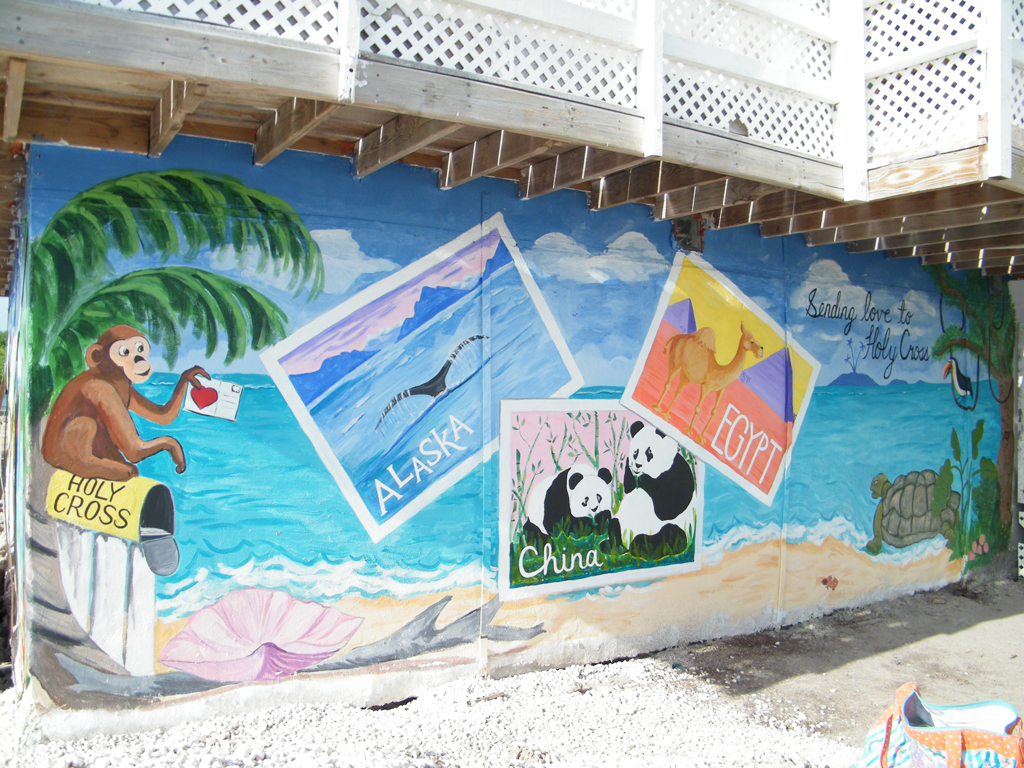 The colorful mural shows Holy Cross children to think outside of the box.