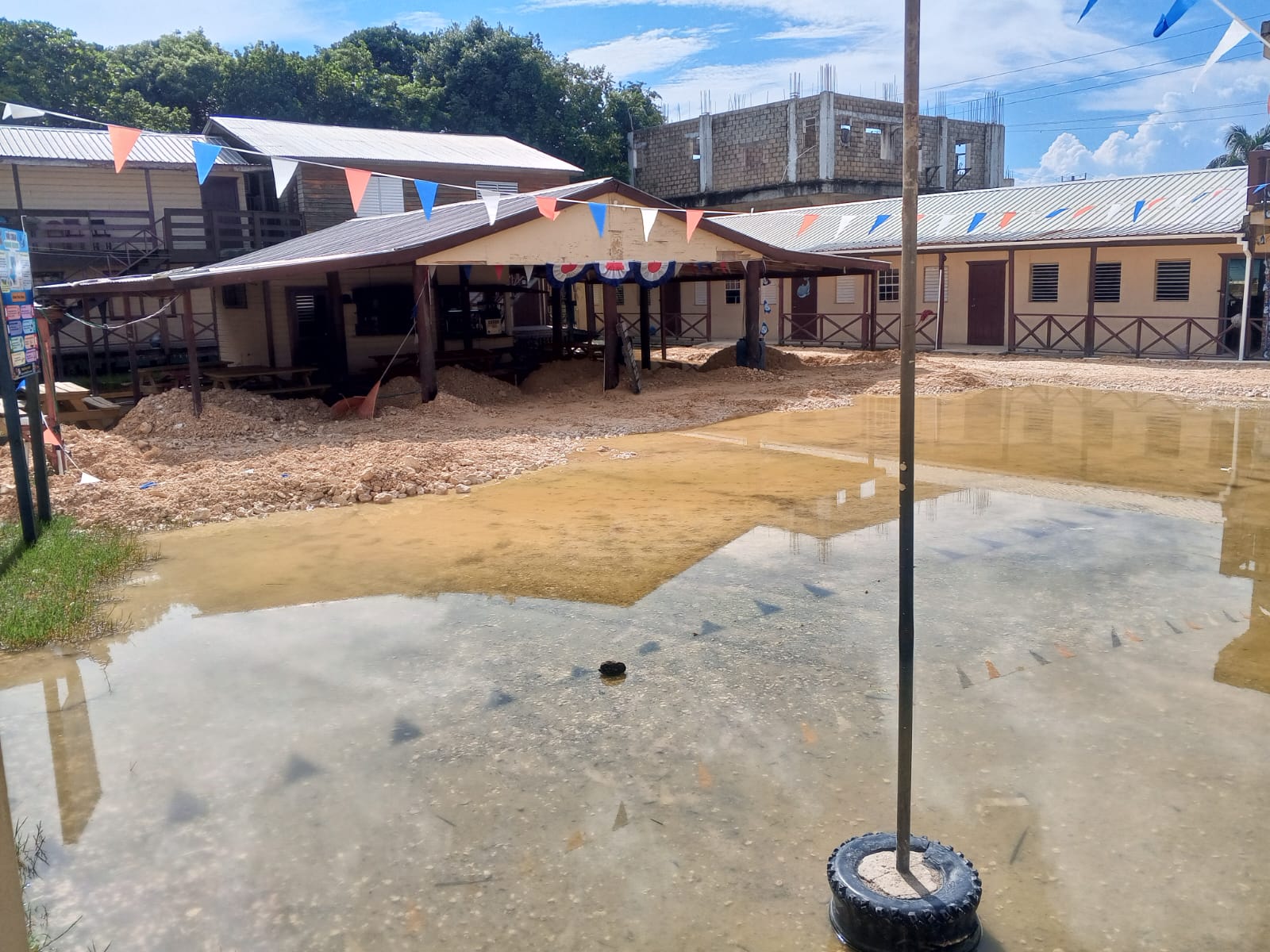 Floodwater at New Horizon SDA School in The San Pedro Sun’s report